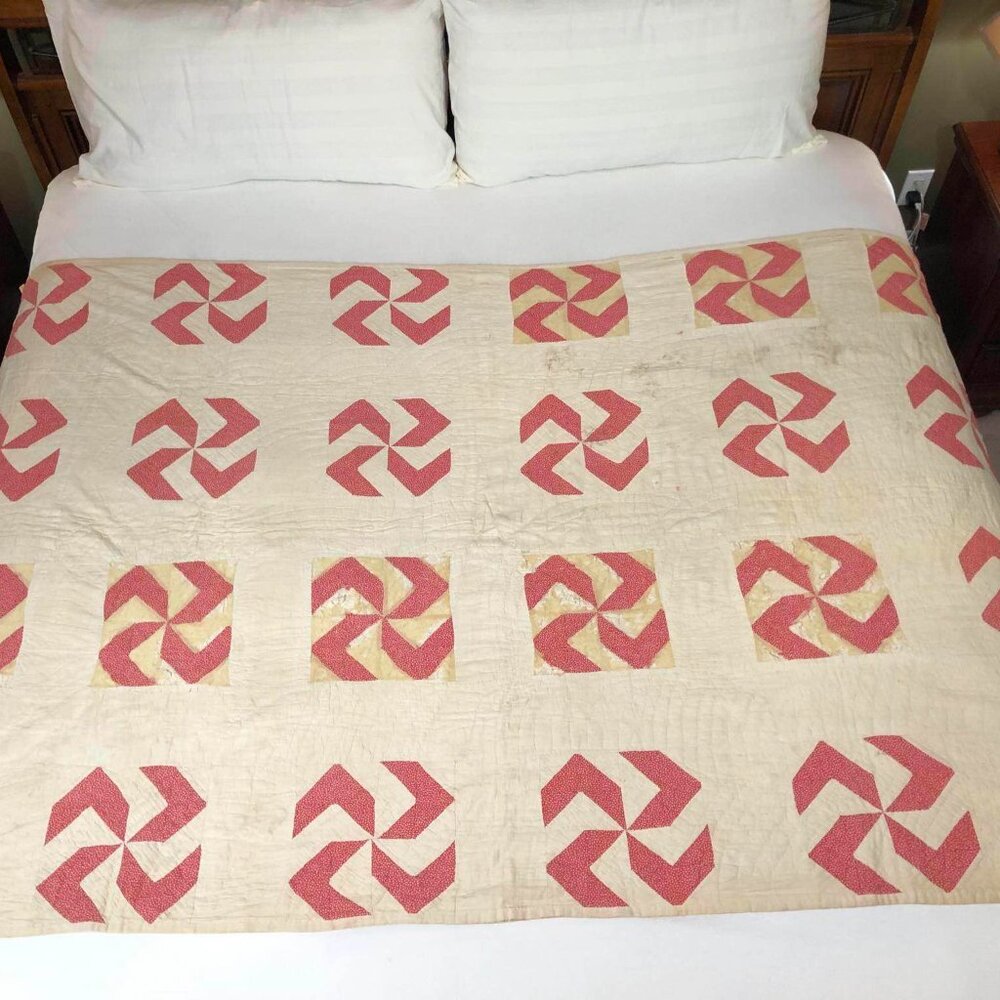 Vintage hand sewn quilt - cream with red pinwheel design